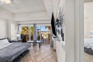 a bedroom with a bed and a view of the ocean at Las Palmas 2BR 2BA Suite 3rd FL Ocean View- B301 in Campo del Medio