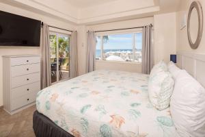 a bedroom with a bed with a view of the ocean at Las Palmas 2BR 2BA Suite 3rd FL Ocean View- B301 in Campo del Medio +39 photos