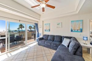a living room with a couch and a ceiling fan at Las Palmas 2BR 2BA Suite 2nd FL Ocean View- G205 in Campo del Medio