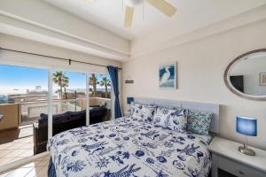 a bedroom with a bed with a view of the ocean at Las Palmas 2BR 2BA Suite 2nd FL Ocean View- G205 in Campo del Medio +54 photos