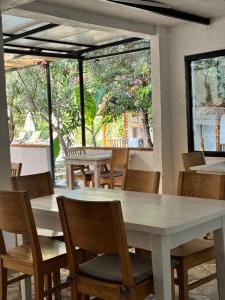 a group of tables and chairs in a restaurant at KiDRAK OTEL MONTENEGRO-1 in Faralya