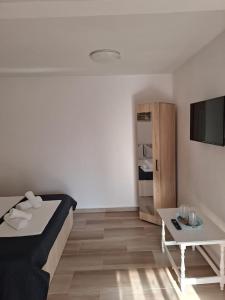 Giường trong phòng chung tại CASA MARIA