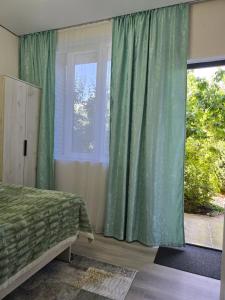 Postel nebo postele na pokoji v ubytování Olga Guest House