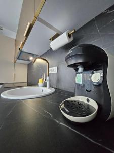 a bathroom with a head with a helmet on the counter at EverGreen Apartment4 in Năvodari +3 photos