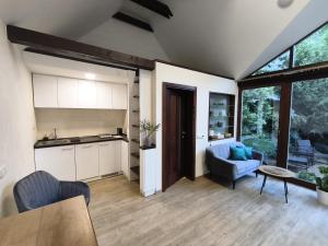 a kitchen and living room with a table and chairs at Nature house Slavkov u Brna in Slavkov u Brna