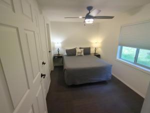 a bedroom with a bed and a ceiling fan at Eagle Cap Chalets in Joseph