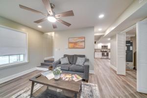 a living room with a couch and a table at Walk to Mellwood Art Center Home with Private Deck! in Louisville