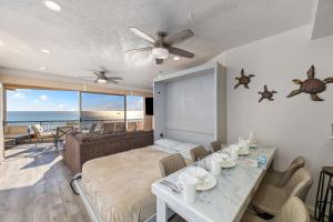 a living room with a bed and a table with chairs at Sonoran Spa 2BR 2BA Sleeps 8 6th Floor- E607 in Campo del Medio