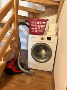 a washing machine with a basket on top of it at KiDRAK OTEL MONTENEGRO-1 in Faralya