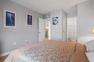 Postel nebo postele na pokoji v ubytování Beach Place