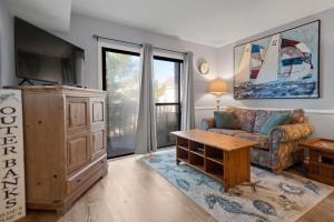 TV a/nebo společenská místnost v ubytování Beach Place