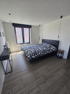 Postel nebo postele na pokoji v ubytování Tomorrowland Crib in de buurt van Boom