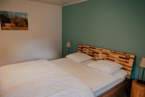 Postel nebo postele na pokoji v ubytování Gîte champêtre Al Wèrihè