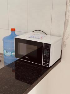 Η κουζίνα ή μικρή κουζίνα στο Nox Temporada Flat 101 com AR, a 5 Min da Feira de Caruaru
