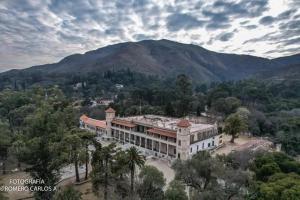 an aerial view of a building with a mountain in the background at El Espinillo in La Falda