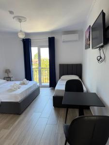 Postel nebo postele na pokoji v ubytování Hotel Vila AARON