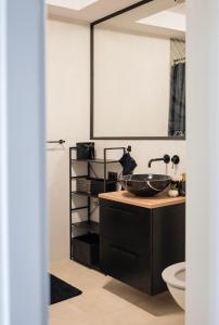 Ένα μπάνιο στο Cozy Stop Apartament