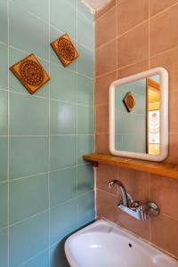 a bathroom with a mirror and a sink at Desert HoM by GLOW in Naẖal Shittim