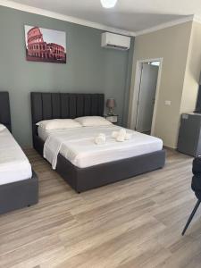 Postel nebo postele na pokoji v ubytování Hotel Vila AARON