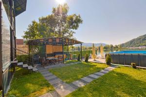 a backyard with a gazebo and a pool at VILA SMARAGD in Zvornik