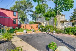 a driveway in a yard with a red house at Walkable Neighborhood Updated Morton Home! 