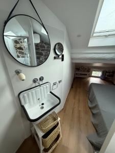 a bathroom with a sink and a mirror on the wall at Casa Tassinca in Tasso +18 photos