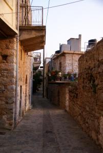 an alley in an old town with a building at Socros Home, Mesta Chios in Mestá