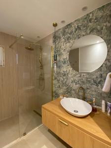 a bathroom with a sink and a shower at Boka Bliss in Zelenika