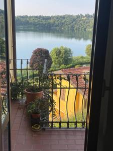 a view of a view of a lake from a balcony at Il Boschetto - Vista Lago in Montorfano