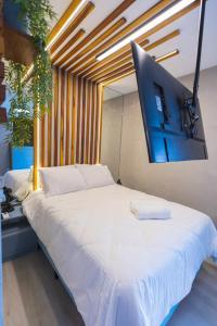 En eller flere senge i et værelse på Flat - Jardim Paulista - Próximo Metrô brigadeiro + 32 billeder