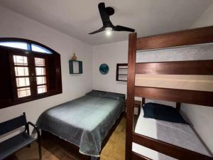 Voodi või voodid majutusasutuse Casa Itagua proximo a praia toas