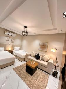 Ένα ή περισσότερα κρεβάτια σε δωμάτιο στο شقق واستديوهات SiS