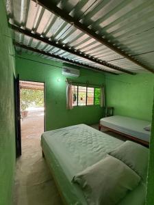 Postel nebo postele na pokoji v ubytování Hostal Héctor