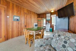 a living room with a table and chairs and a couch at Les Cheneaux Islands Retreat 2 Boat, Fish and Swim in Cedarville +37 photos