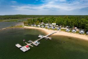 an aerial view of a beach with boats in the water at Les Cheneaux Islands Retreat 2 Boat, Fish and Swim in Cedarville