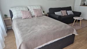 Posteľ alebo postele v izbe v ubytovaní Solny Resort - Apartament Aida A048