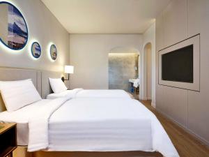 Mercure Vung Tau Resort客房内的一张或多张床位