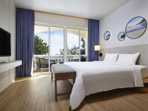 Mercure Vung Tau Resort客房内的一张或多张床位