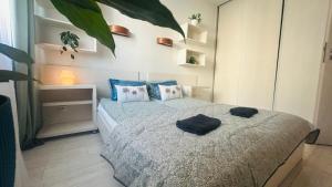 Łóżko lub łóżka w pokoju w obiekcie Apartament Słoneczny 10