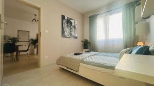 Łóżko lub łóżka w pokoju w obiekcie Apartament Słoneczny 10