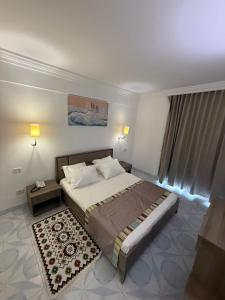 Postel nebo postele na pokoji v ubytování TREE HOUSE HOTEL Sousse