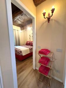 a room with a bed and a room with a mirror at Luna Home in Arona