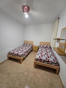 Posteľ alebo postele v izbe v ubytovaní Apartamento muy cerca de la playa