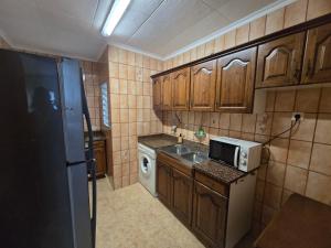 Kuchyňa alebo kuchynka v ubytovaní Apartamento muy cerca de la playa
