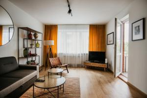 Μια τηλεόραση ή/και κέντρο ψυχαγωγίας στο Polanka Apartament By IMPERO
