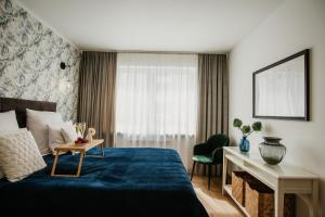 Ένα ή περισσότερα κρεβάτια σε δωμάτιο στο Polanka Apartament By IMPERO