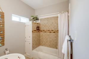 a bathroom with a shower and a bath tub at Quaint Home 16 Mi to Bear Lake Fish, Hike and Golf! in Montpelier