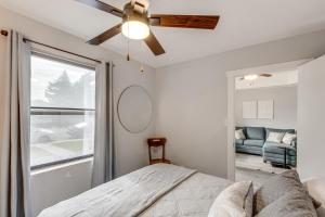 a bedroom with a bed and a ceiling fan at Quaint Home 16 Mi to Bear Lake Fish, Hike and Golf! in Montpelier