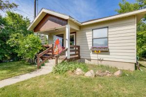 a small house with a porch and stairs to the door at Quaint Home 16 Mi to Bear Lake Fish, Hike and Golf! in Montpelier