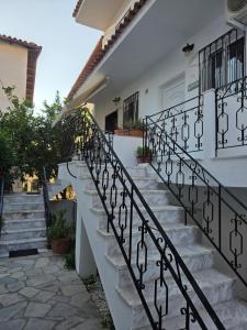 a set of stairs leading up to a house at Bright & Bloom maisonette in Hanioti